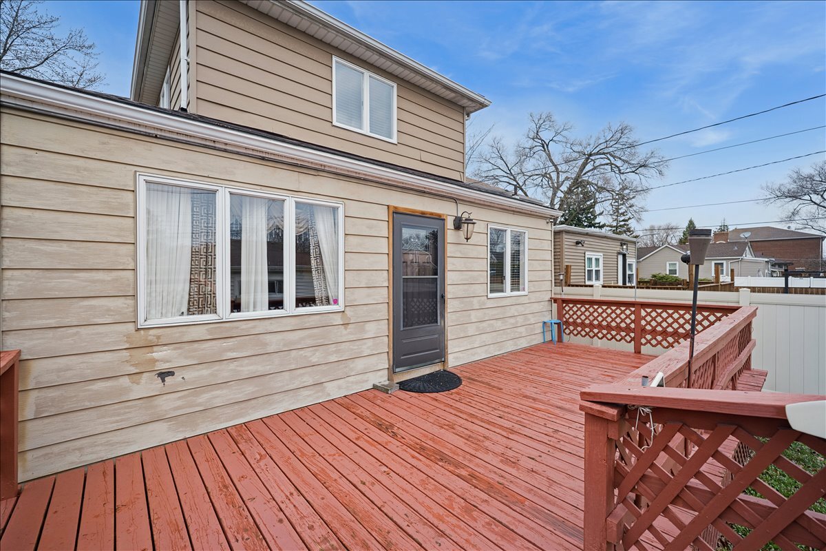 2455 North Rhodes Avenue River Grove, IL 60171 - Photo 18 of 24 a view of a house with wooden deck