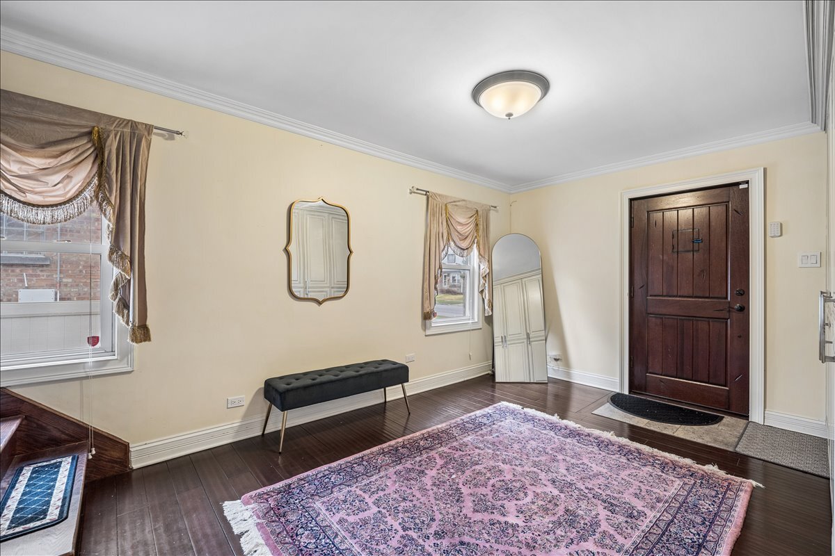 2455 North Rhodes Avenue River Grove, IL 60171 - Photo 3 of 24 a bedroom with furniture and a rug