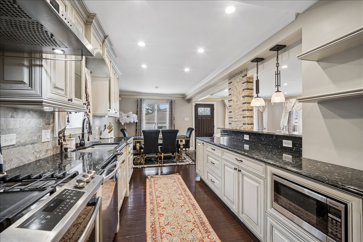 2455 North Rhodes Avenue River Grove, IL 60171 - Photo 5 of 24 a kitchen with granite countertop lots of counter top space and stainless steel appliances