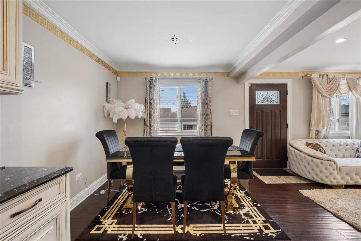 2455 North Rhodes Avenue River Grove, IL 60171 - Photo 7 of 24 a view of a dining room with furniture window and wooden floor