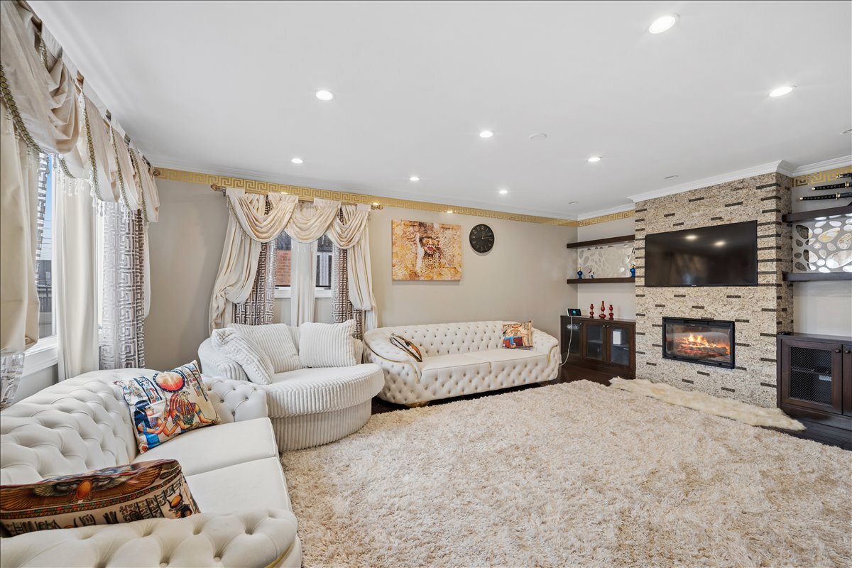 2455 North Rhodes Avenue River Grove, IL 60171 - Photo 9 of 24 a living room with furniture and a flat screen tv