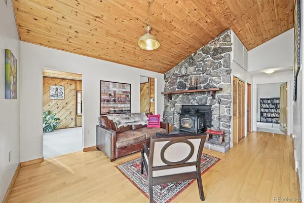 a living room with fireplace furniture and a fireplace