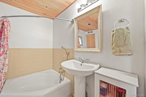 a bathroom with a sink and a bathtub