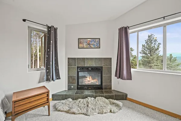 a view of walk in closet with clothes