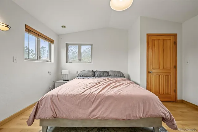 a bedroom with a bed and a view of bathroom