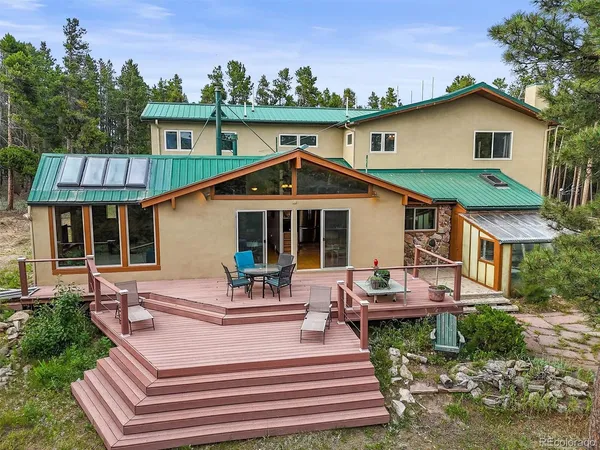 a view of a deck with wooden floor and seating space