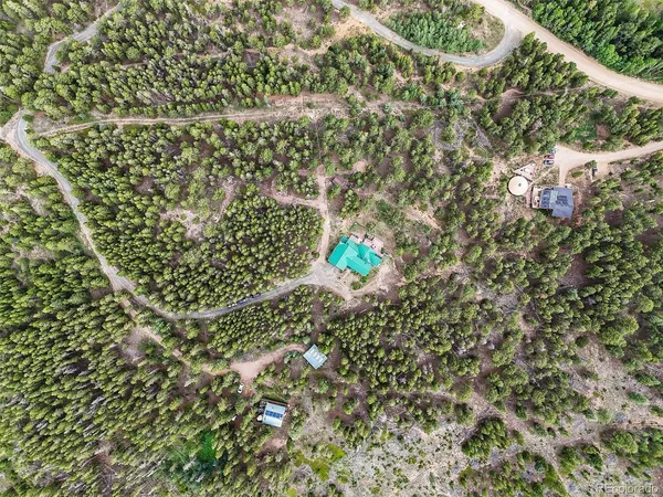 a view of a mountain range with lush green forest