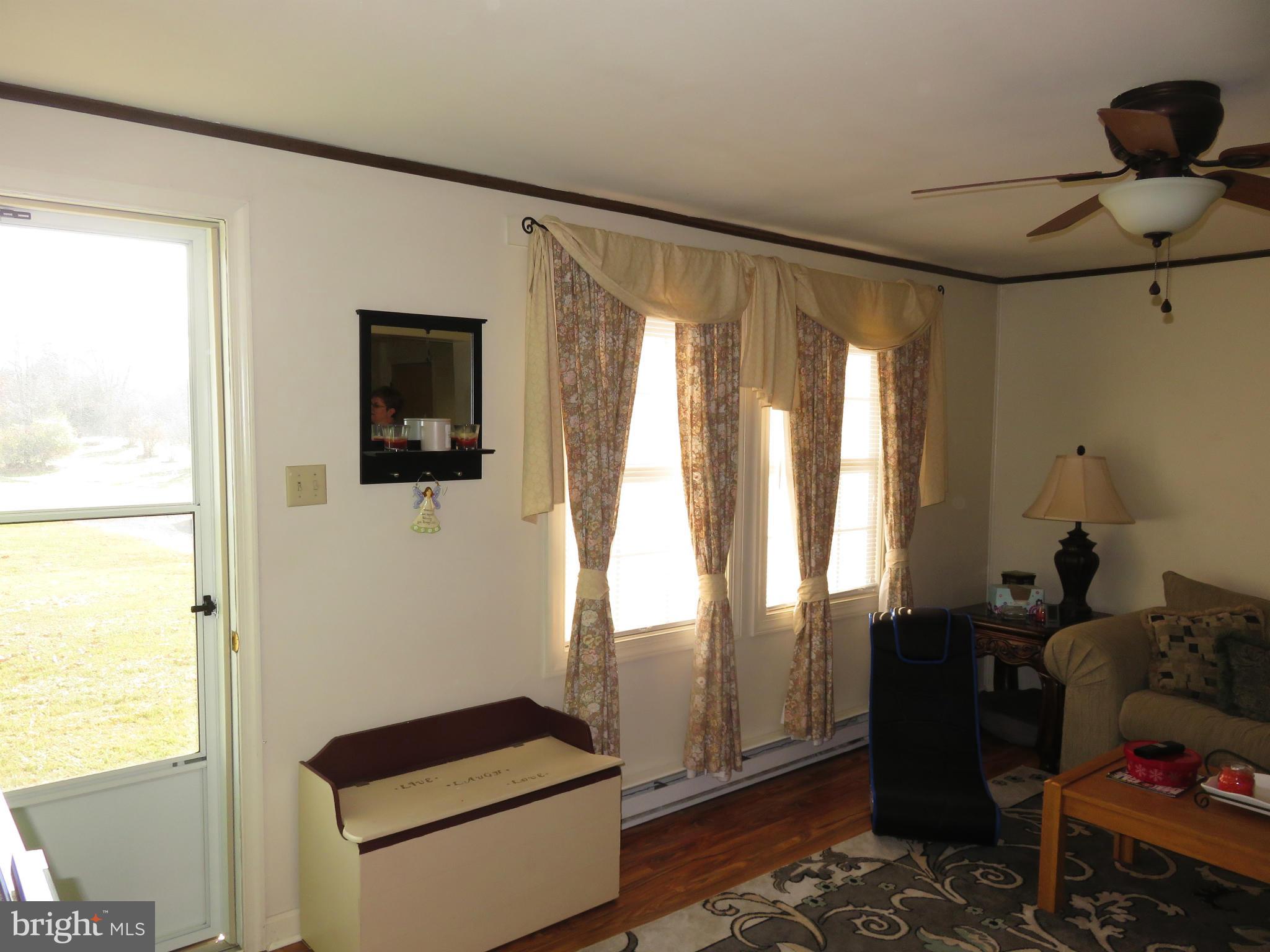 244 1st Street Inwood, WV 25428 - Photo 8 of 17 LIVING ROOM FRONT ENTRANCE