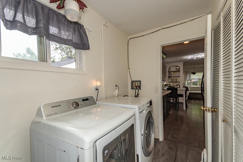 4973 Orchard Road Mentor, OH 44060 - Photo 15 of 30 Laundry room featuring washing machine and dryer and dark wood-type flooring