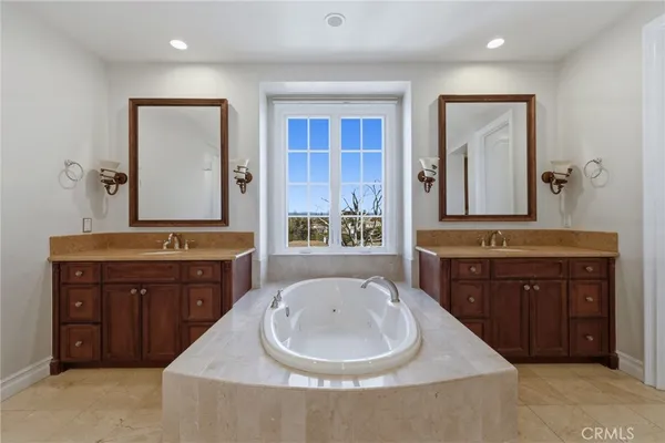 a bathroom with a sink double vanity and a mirror