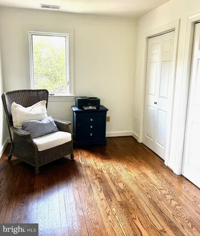 a spacious bedroom with a bed and a window