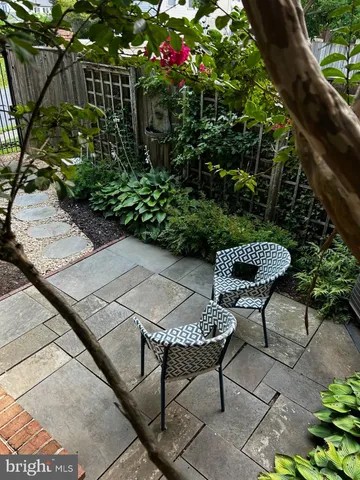 a garden view with a seating space