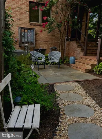 a backyard of a house with outdoor seating