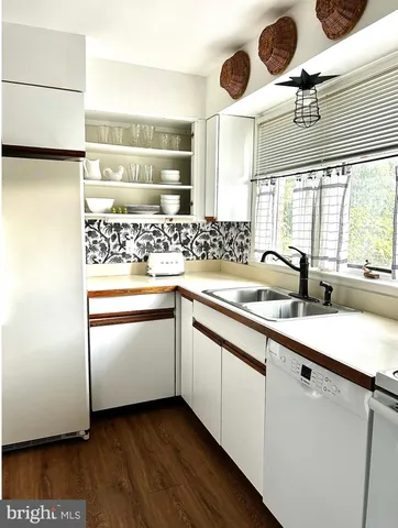 a kitchen with a sink and a stove