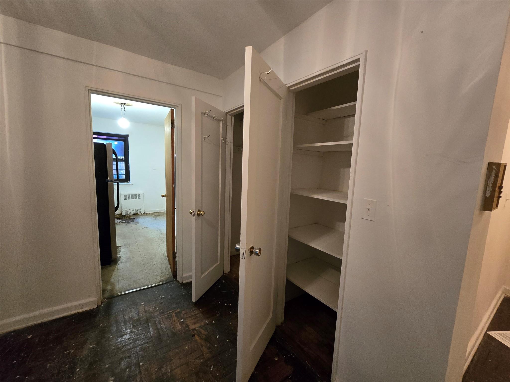 102-25 67th Road, Unit 1F Queens, NY 11375 - Photo 4 of 6 Closet featuring radiator heating unit