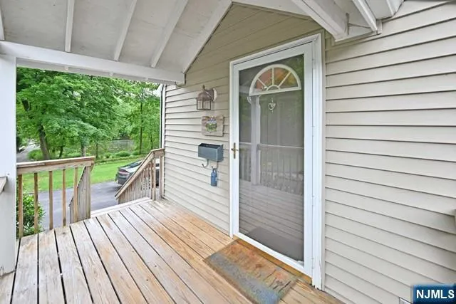 a view of a balcony with wooden floor
