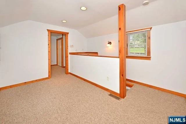 an entryway at an empty room with a window