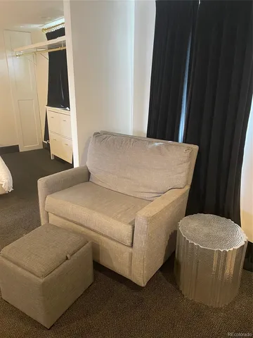 a living room with a couch and a table