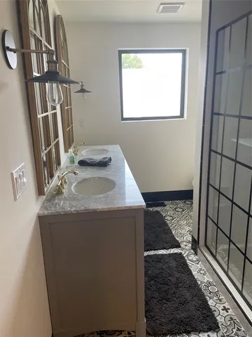 a utility room with a sink a washer and dryer