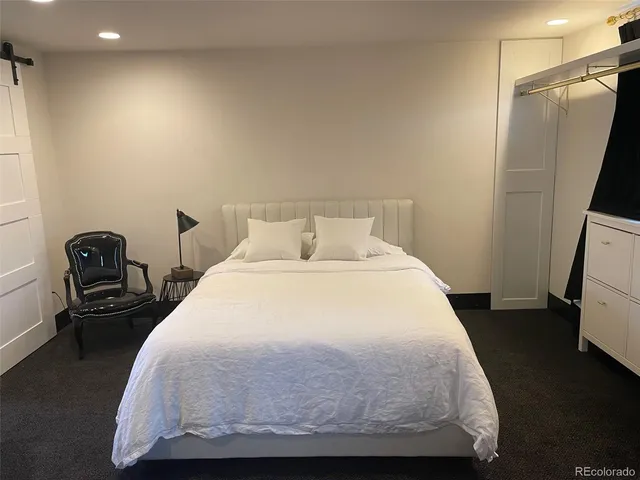 a bedroom with a bed and furniture