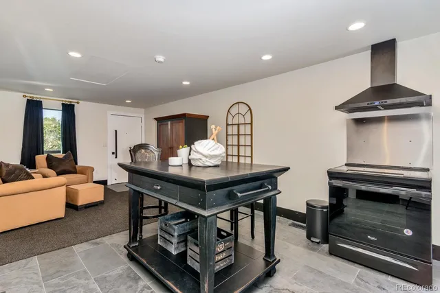 a living room with furniture and a piano