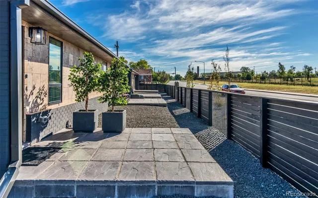 a view of a balcony with furniture