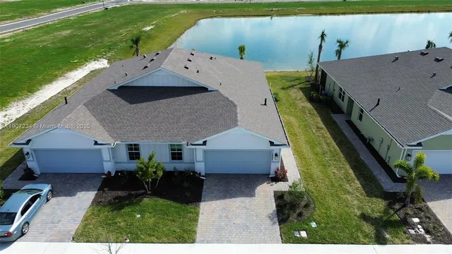an aerial view of a house with a yard