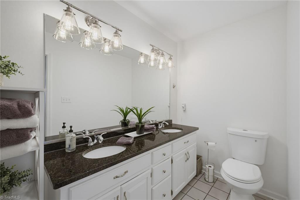 2800 Spencers Grove Road Browns Summit, NC 27214 - Photo 27 of 49 Primary bathroom with double sinks and granite.