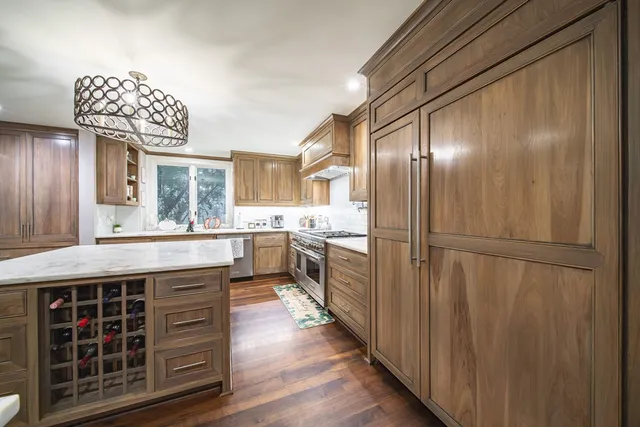 a living room with lots of furniture and wooden floor