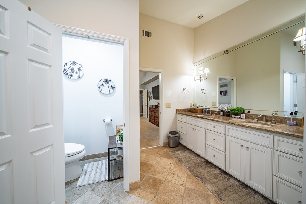517 Double Churches Road Columbus, GA 31904 - Photo 36 of 96 a large bathroom with a granite countertop sink a toilet and a shower