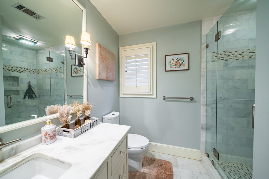 517 Double Churches Road Columbus, GA 31904 - Photo 43 of 96 a bathroom with a sink a toilet and shower