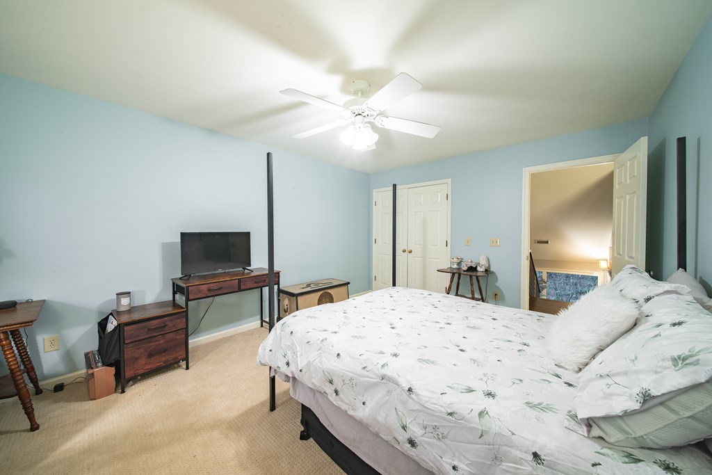517 Double Churches Road Columbus, GA 31904 - Photo 50 of 96 a bedroom with a bed and a television