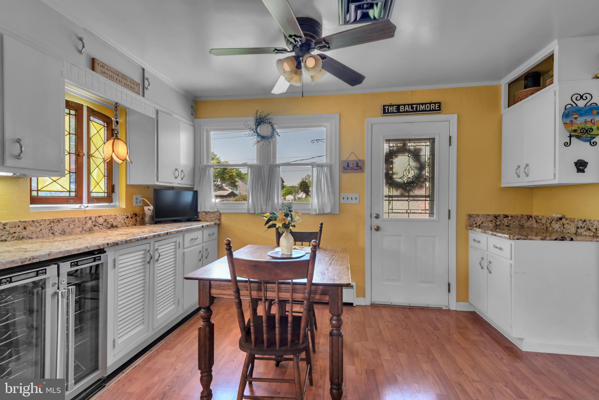 4249 Kings Road Edgewater, MD 21037 - Photo 11 of 54 a large kitchen with a table and chairs