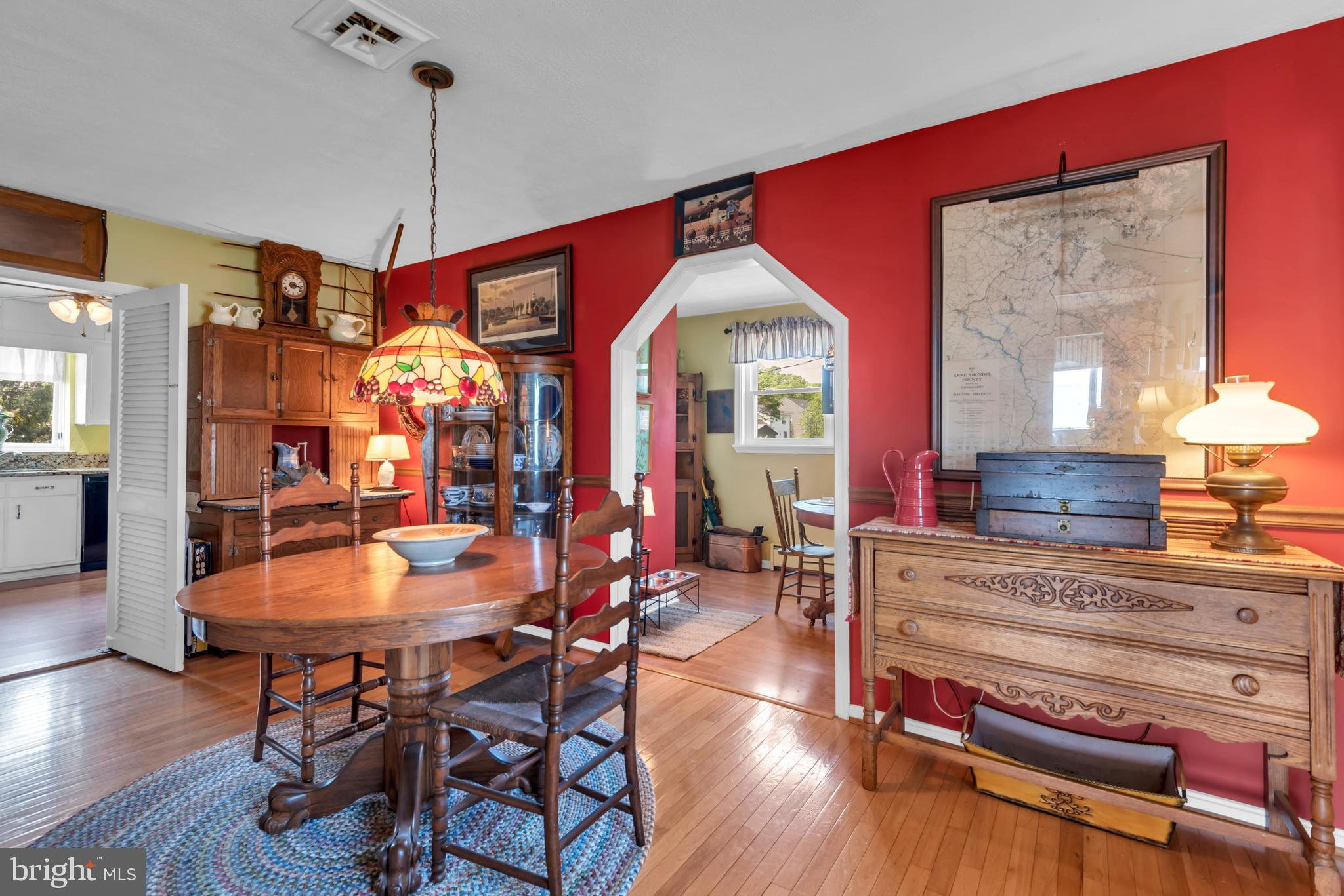 4249 Kings Road Edgewater, MD 21037 - Photo 14 of 54 a view of a dining room with furniture window and wooden floor