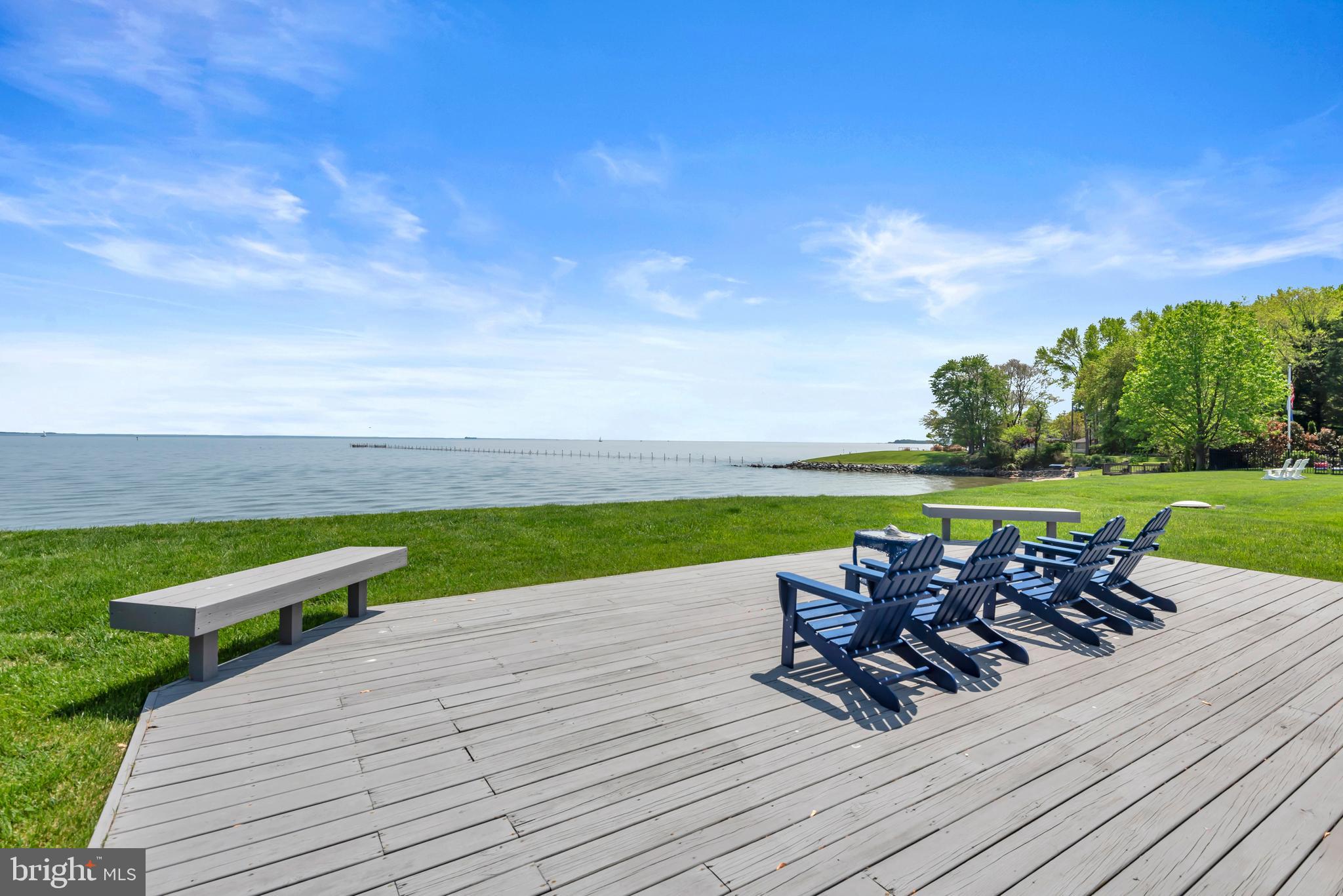 4249 Kings Road Edgewater, MD 21037 - Photo 24 of 54 a view of a patio with lawn chairs plants and large tree