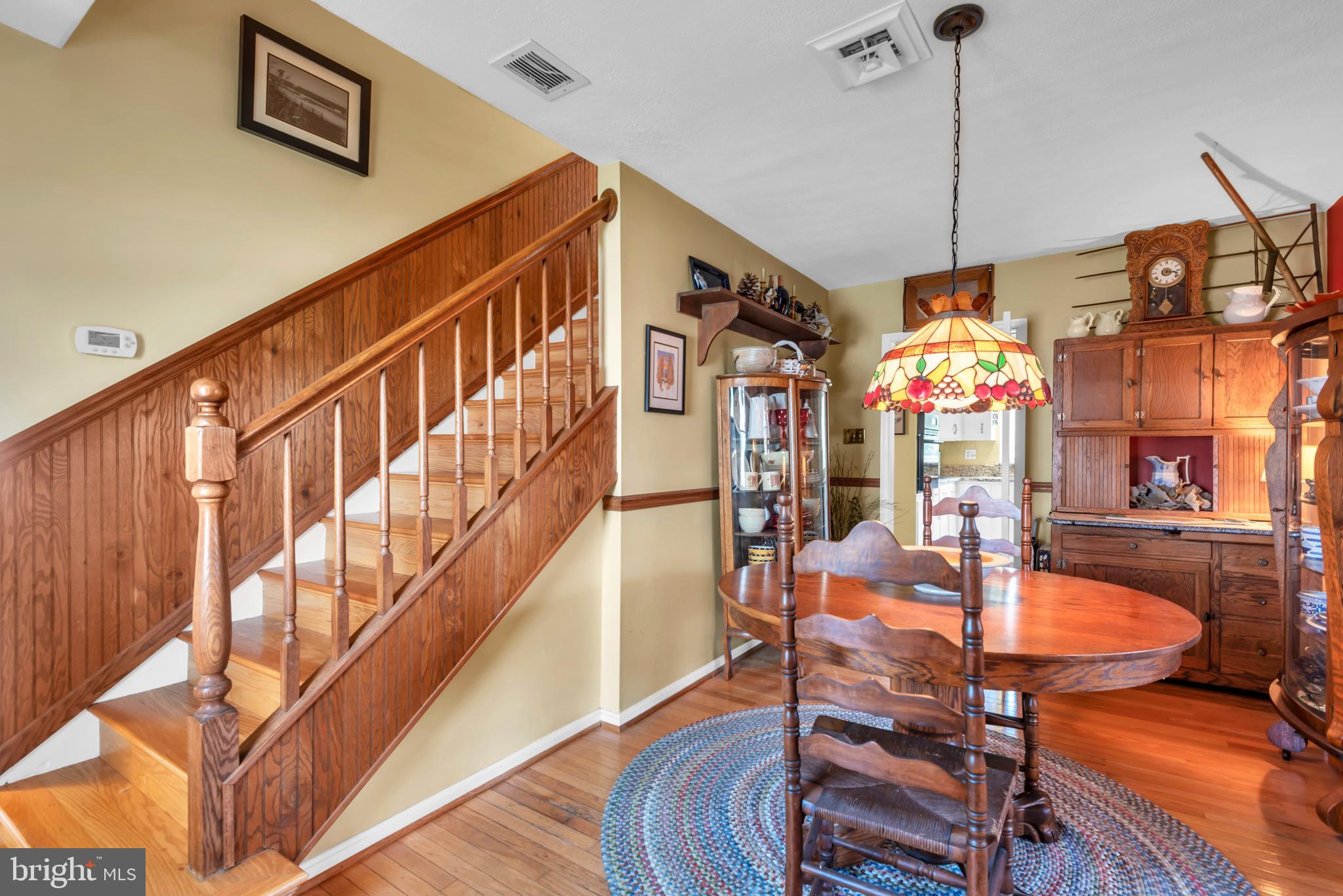 4249 Kings Road Edgewater, MD 21037 - Photo 25 of 54 a dining room with furniture a chandelier and wooden floor