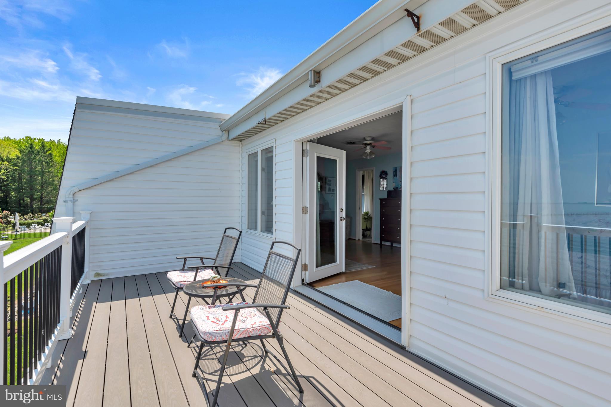 4249 Kings Road Edgewater, MD 21037 - Photo 30 of 54 a view of a patio with table and chairs and wooden floor