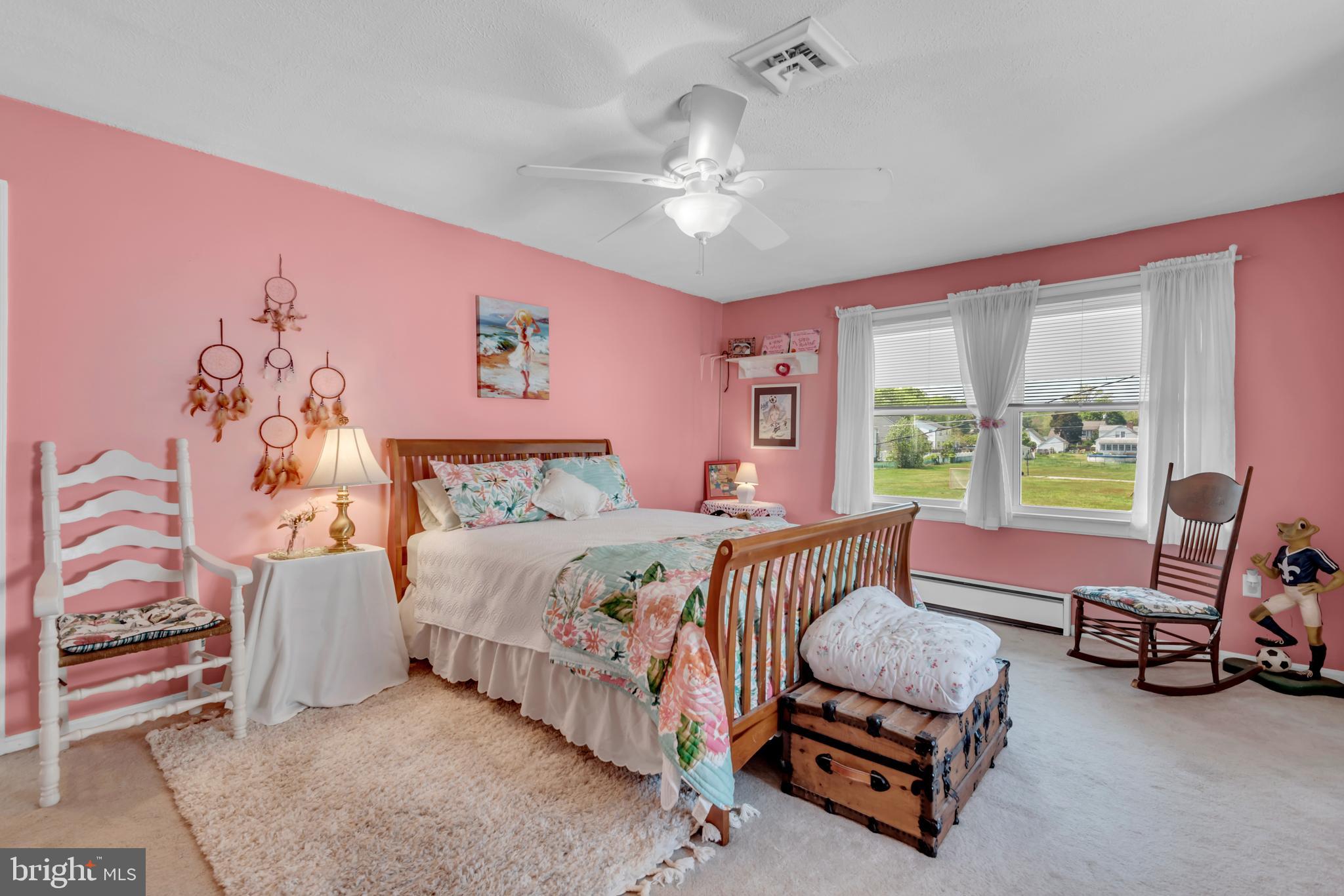4249 Kings Road Edgewater, MD 21037 - Photo 34 of 54 a bedroom with a bed a couch and a window
