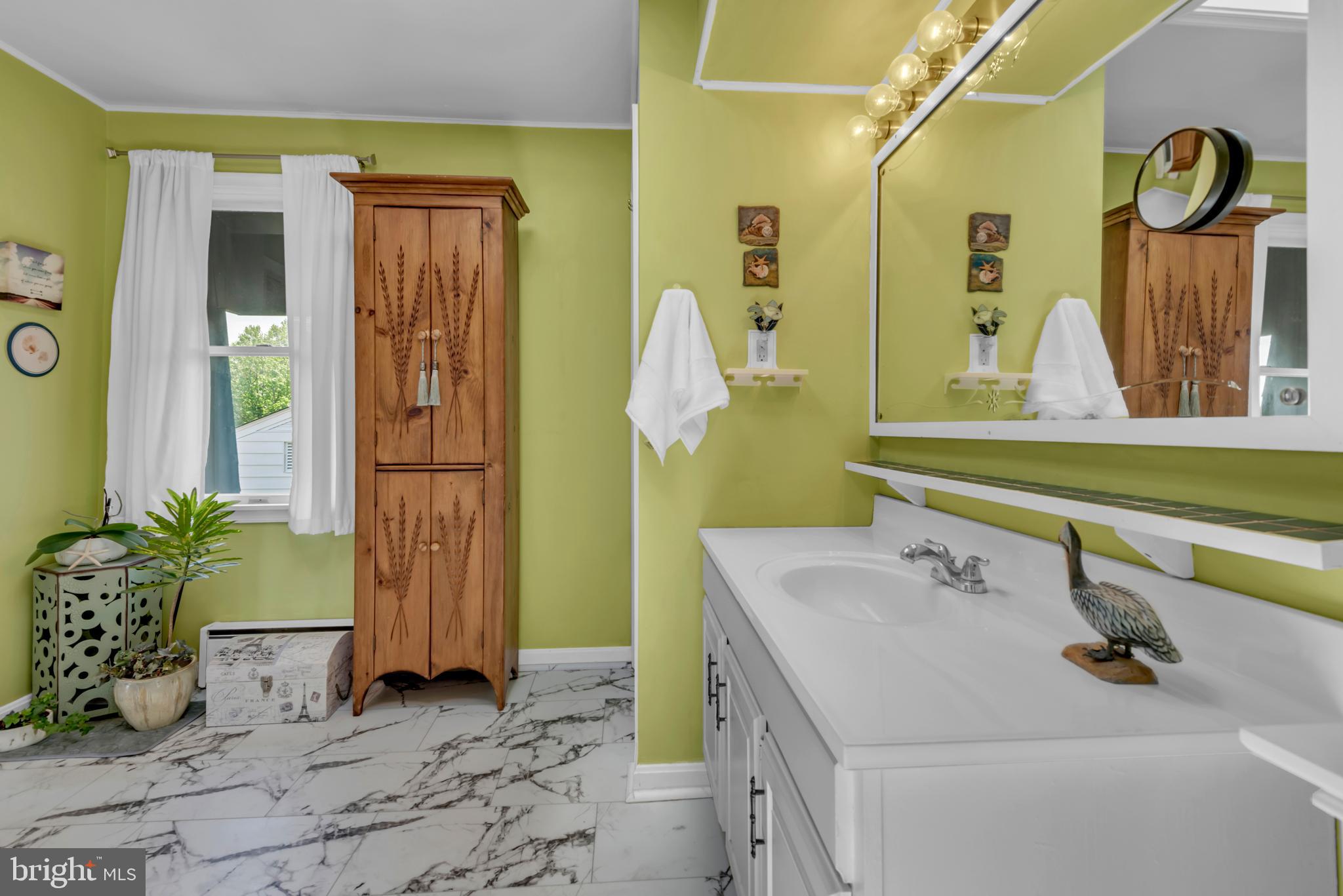 4249 Kings Road Edgewater, MD 21037 - Photo 38 of 54 a bathroom with a sink and a mirror