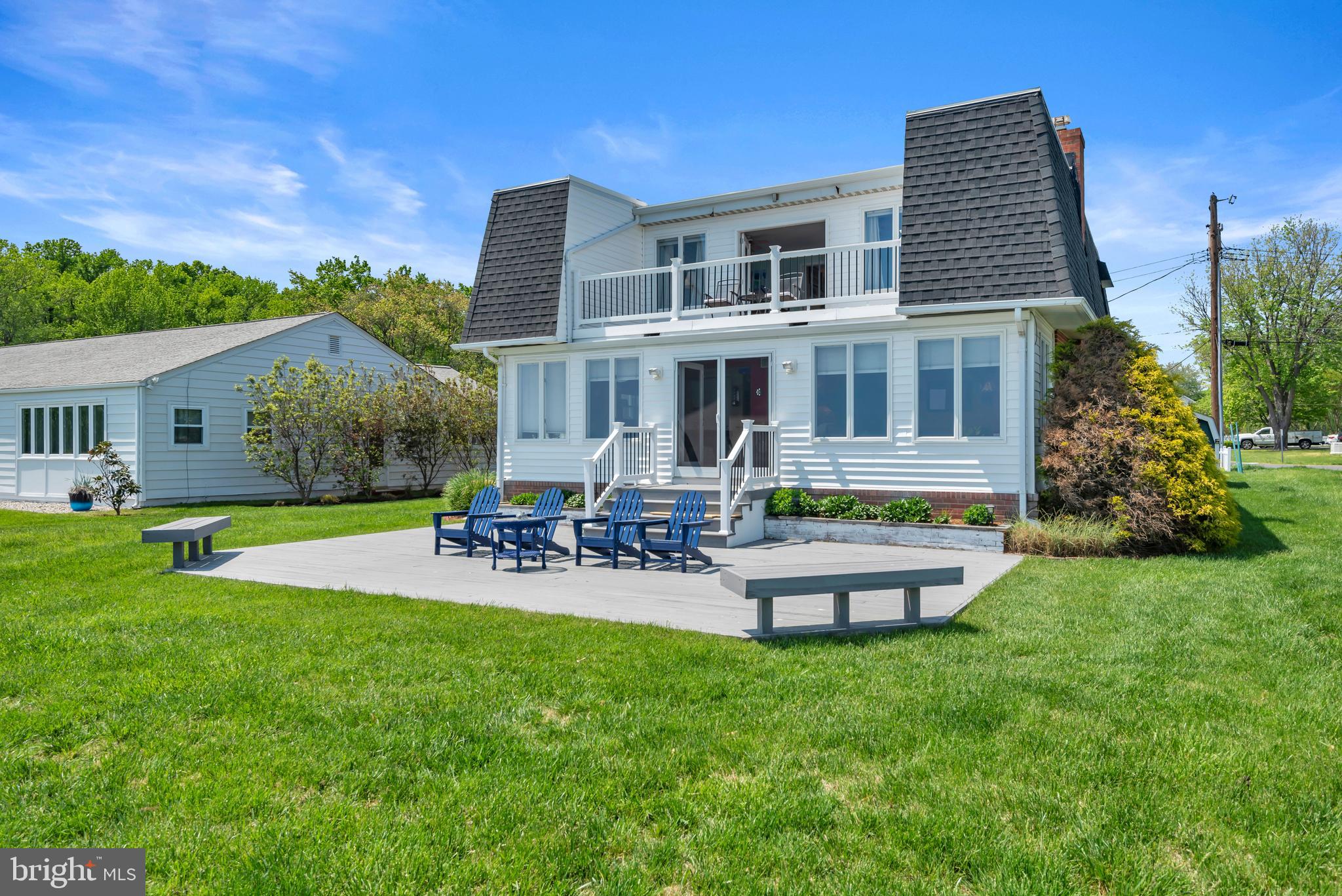 4249 Kings Road Edgewater, MD 21037 - Photo 39 of 54 a front view of a house with garden and sitting area