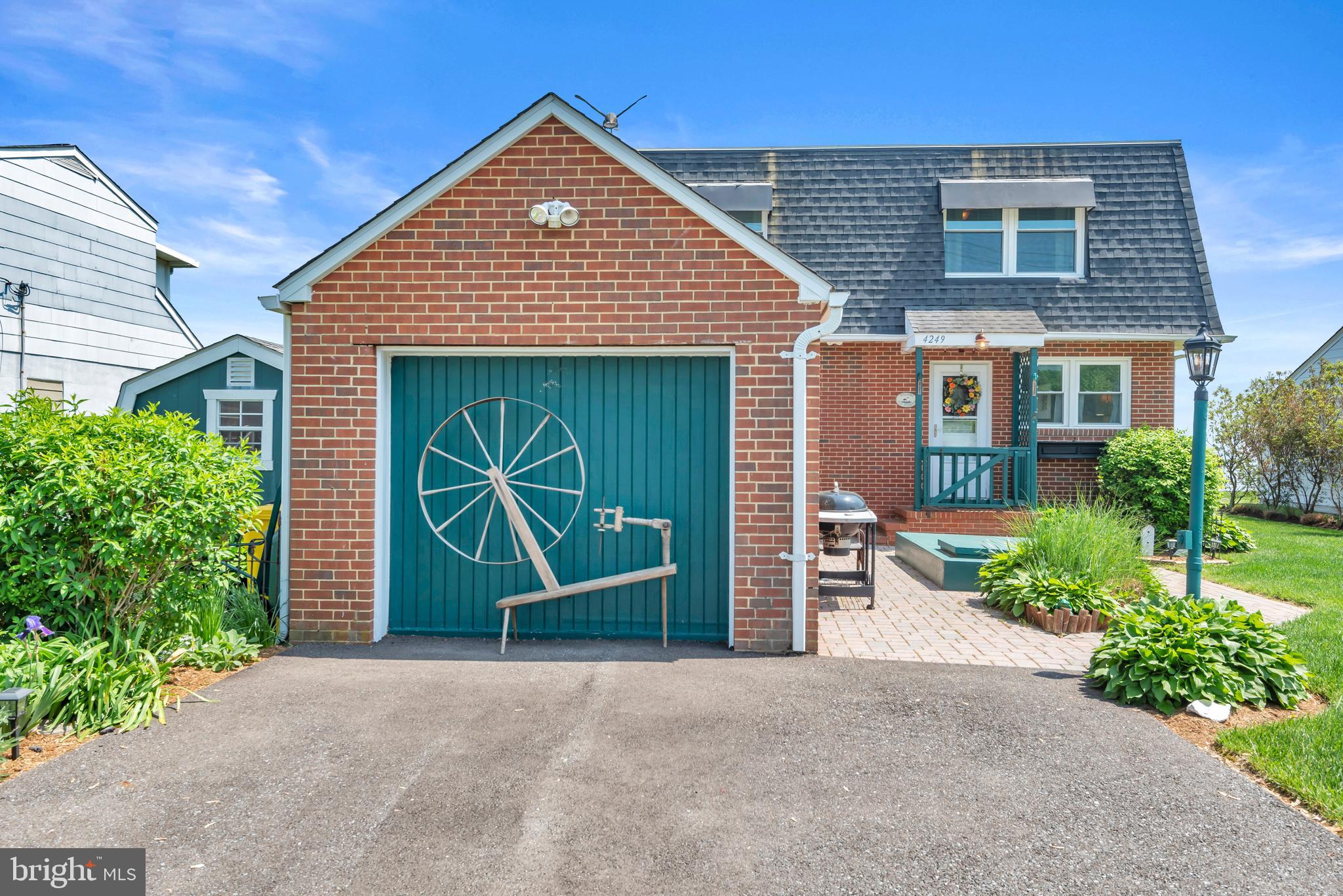 4249 Kings Road Edgewater, MD 21037 - Photo 7 of 54 a front view of a house with a yard and garage