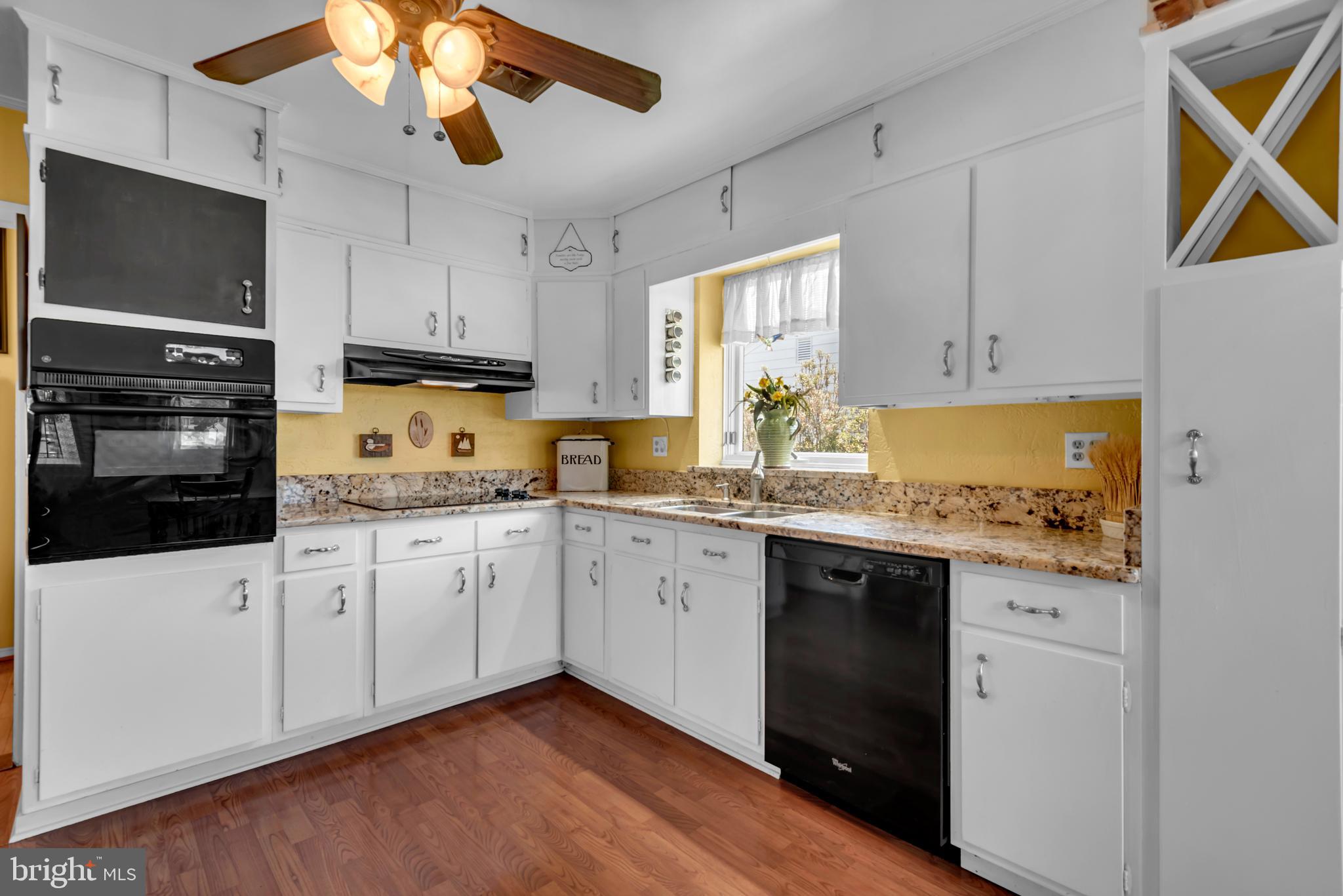4249 Kings Road Edgewater, MD 21037 - Photo 10 of 54 a kitchen with a sink a stove and cabinets