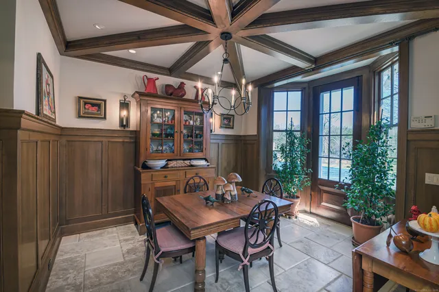 a view of a dining room with furniture window and outside view