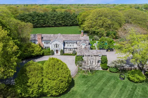 an aerial view of a house with a garden