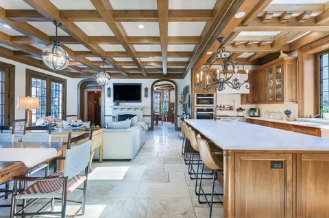 a open kitchen with lot of counter top space a sink and appliances