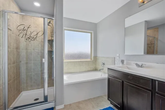 a bathroom with a bathtub and a sink
