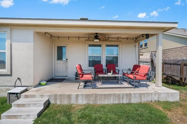 a view of a front of house with an outdoor seating