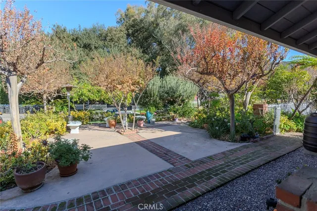 a view of a backyard with sitting area