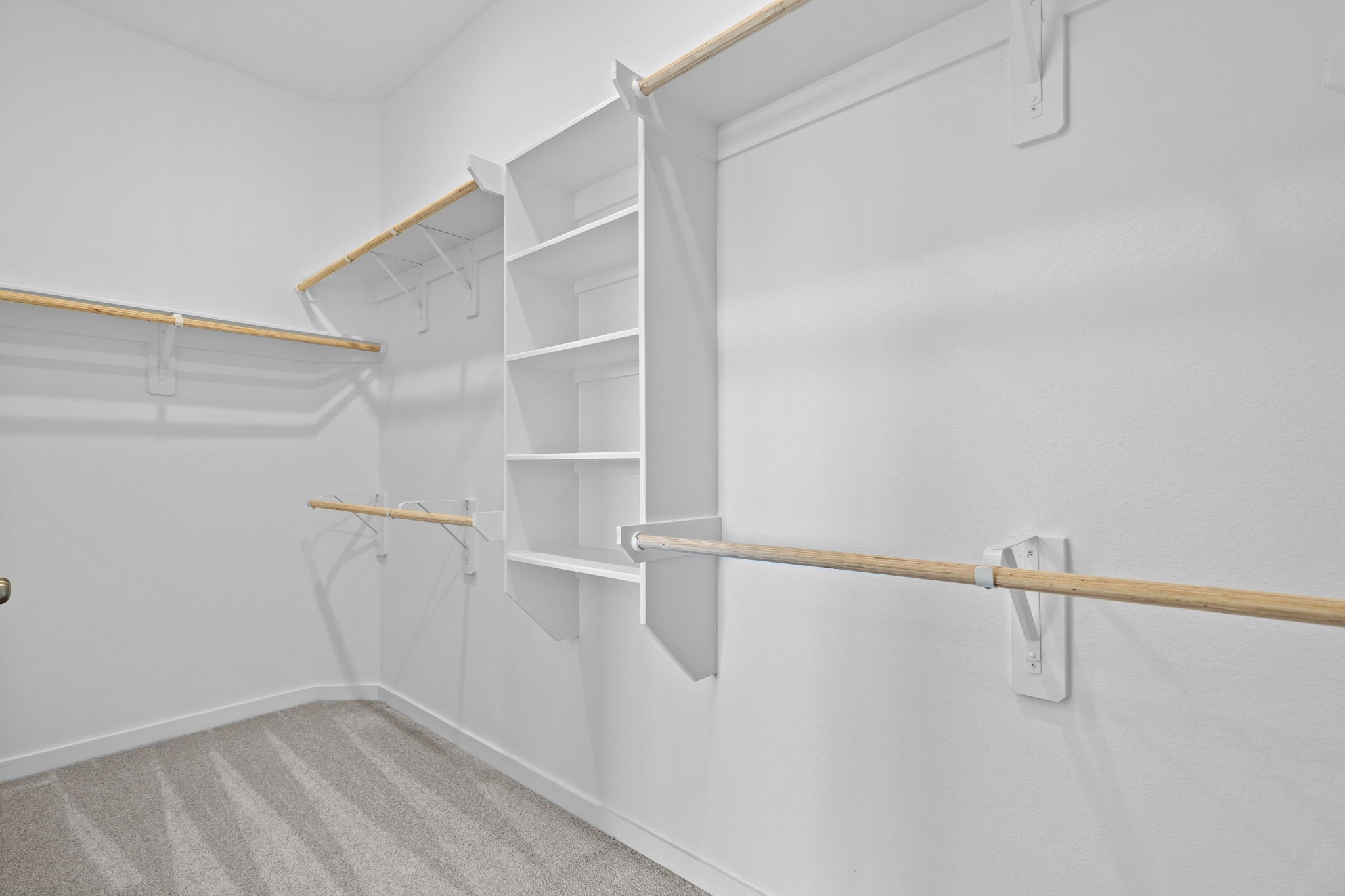 2720 Grove Crest Drive Rosenberg, TX 77469 - Photo 23 of 32 Oversized walk-in closet with built-in shelving and multiple hanging areas for exceptional organization and storage.