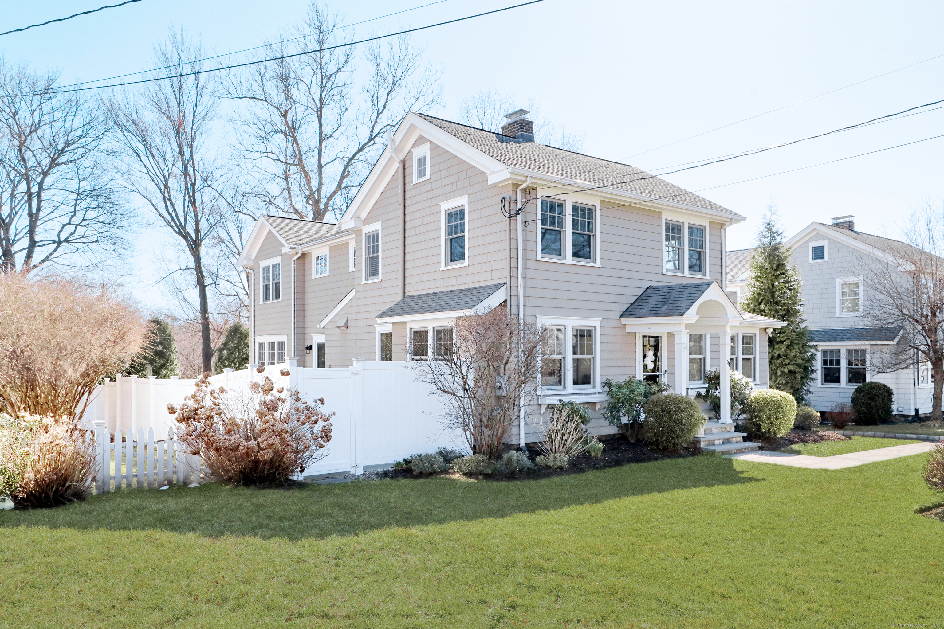 64 Middlesex Road Darien, CT 06820 - Photo 1 of 1 a front view of a house with a garden